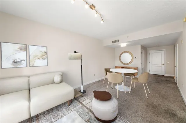 a kitchen with a sink and a stove top oven