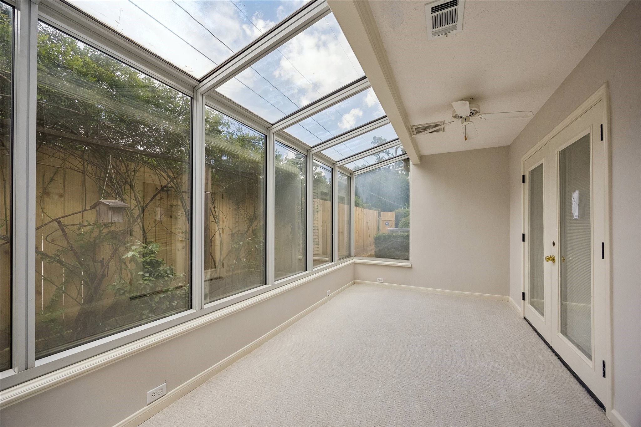 306 Gessner Road Bunker Hill Village, TX 77024 - Photo 22 of 41 The air conditioned sun room s a great space for a study, a workout room or an art studo. New carpet and new french doors.
