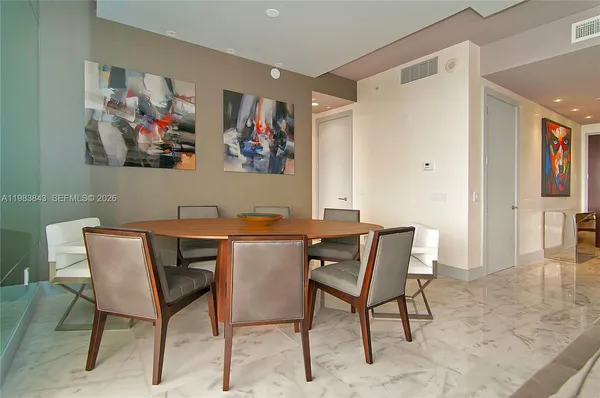 a view of a dining room with furniture