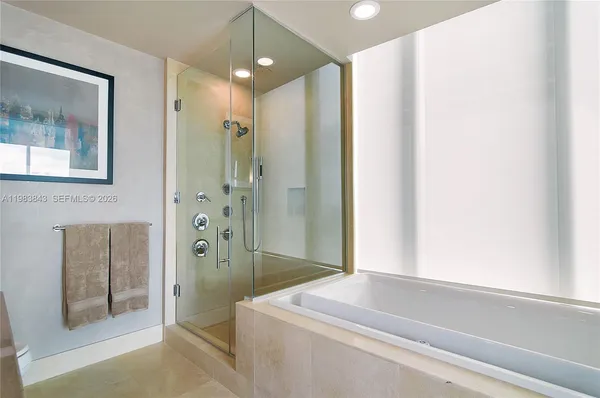 a bathroom with a shower and a sink