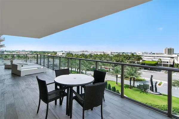 a view of a chairs and table on the terrace