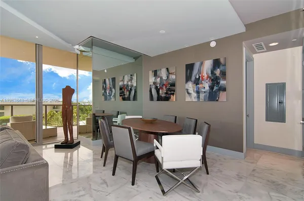 a view of a dining room with furniture window and outside view