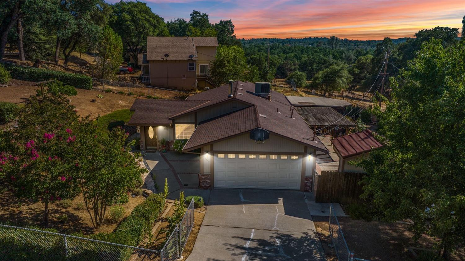 an aerial view of houses with a yard