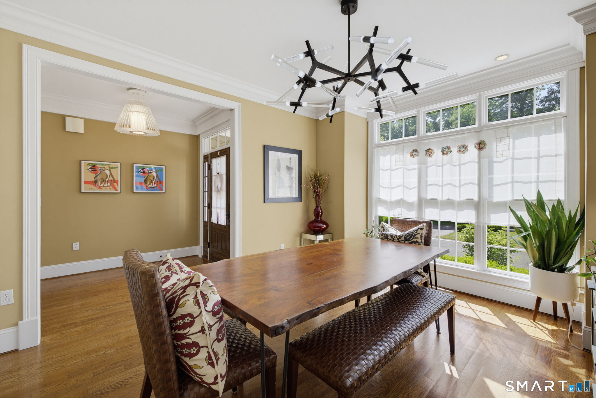 158 Appian Way Coventry, CT 06238 - Photo 10 of 40 a view of a dining room with furniture window and wooden floor
