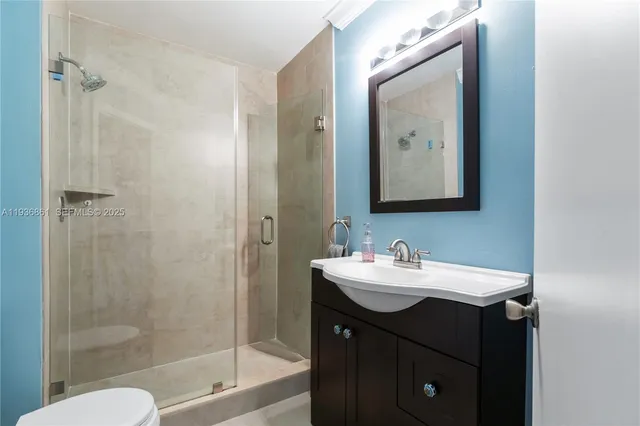 a bathroom with a shower and toilet