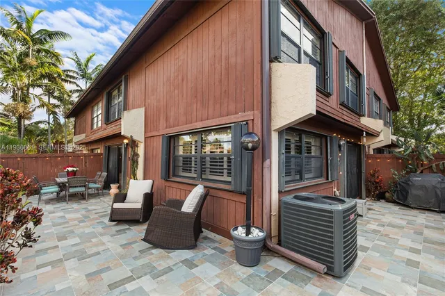 a view of two chairs in patio