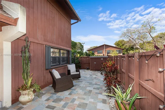 a view of a swimming pool and lounge chairs