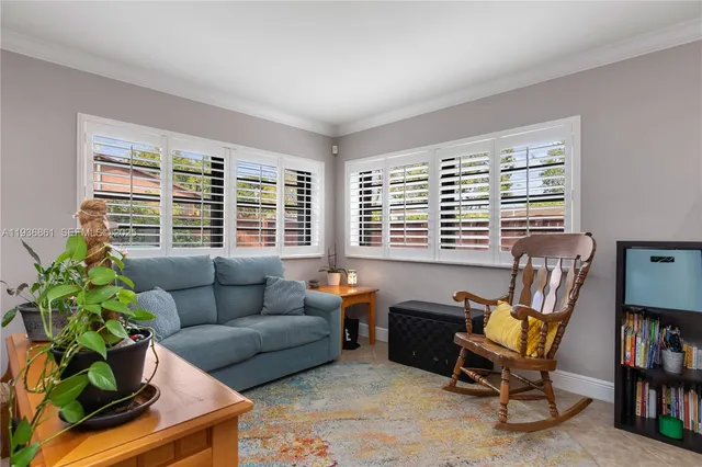 a living room with furniture and a window