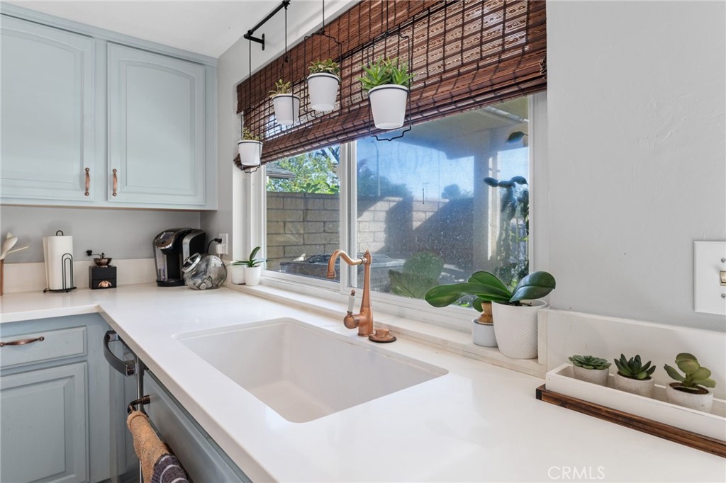 2565 Laramie Road Riverside, CA 92506 - Photo 12 of 46 a kitchen with a sink and a stove top oven