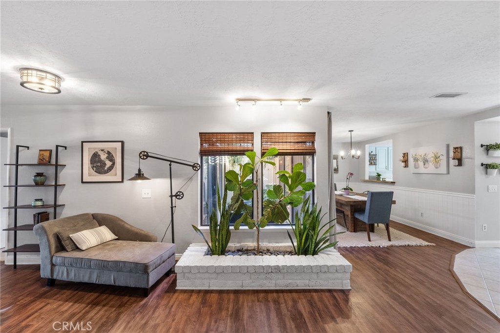 2565 Laramie Road Riverside, CA 92506 - Photo 18 of 46 a living room with furniture and a wooden floor