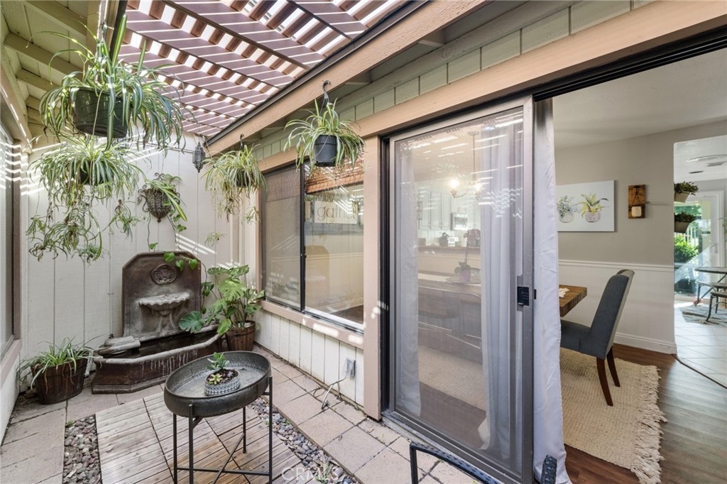 2565 Laramie Road Riverside, CA 92506 - Photo 21 of 46 a room with furniture and wooden floor