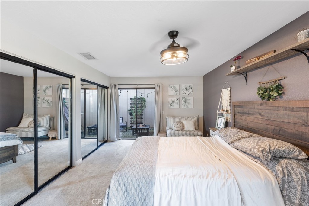 2565 Laramie Road Riverside, CA 92506 - Photo 25 of 46 a bedroom with a bed and a large window