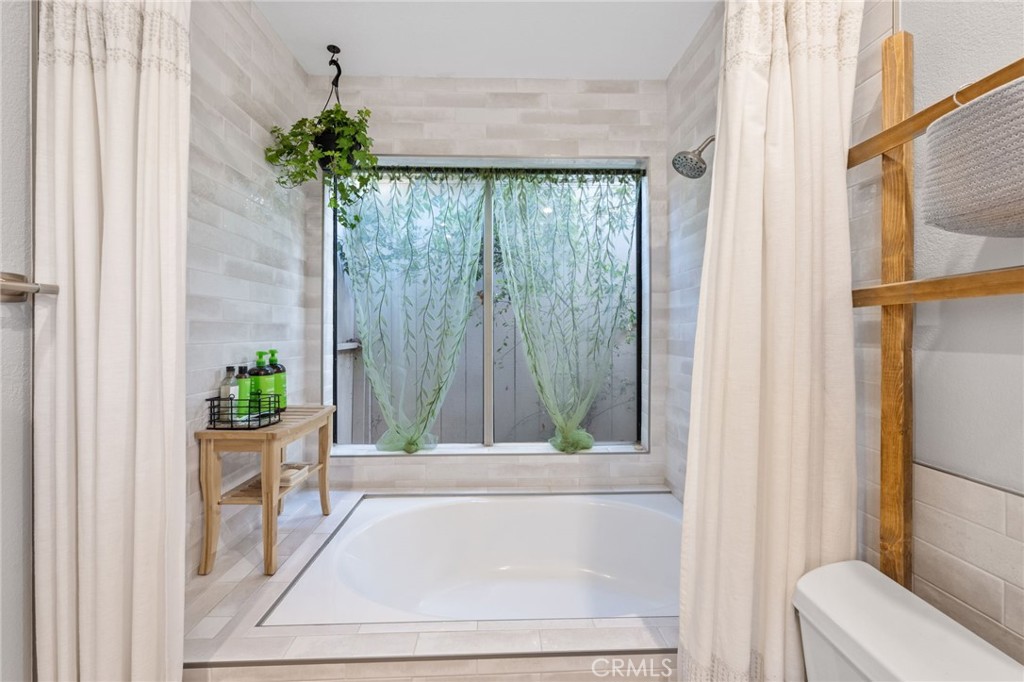 2565 Laramie Road Riverside, CA 92506 - Photo 28 of 46 a living room with a garden and a window