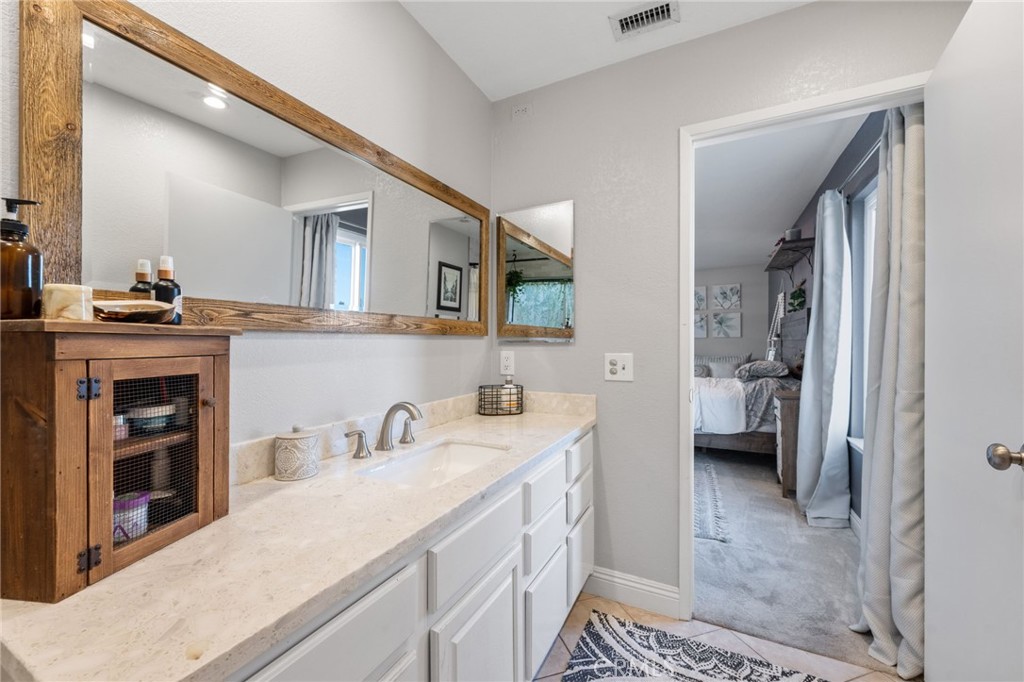 2565 Laramie Road Riverside, CA 92506 - Photo 29 of 46 a bathroom with a sink a toilet and shower