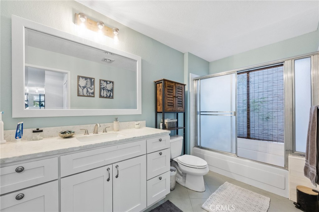 2565 Laramie Road Riverside, CA 92506 - Photo 30 of 46 a bathroom with a toilet sink and shower