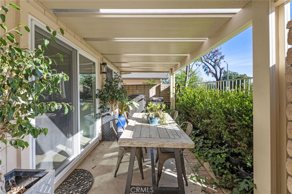 2565 Laramie Road Riverside, CA 92506 - Photo 4 of 46 a view of a patio with table and chairs and potted plants