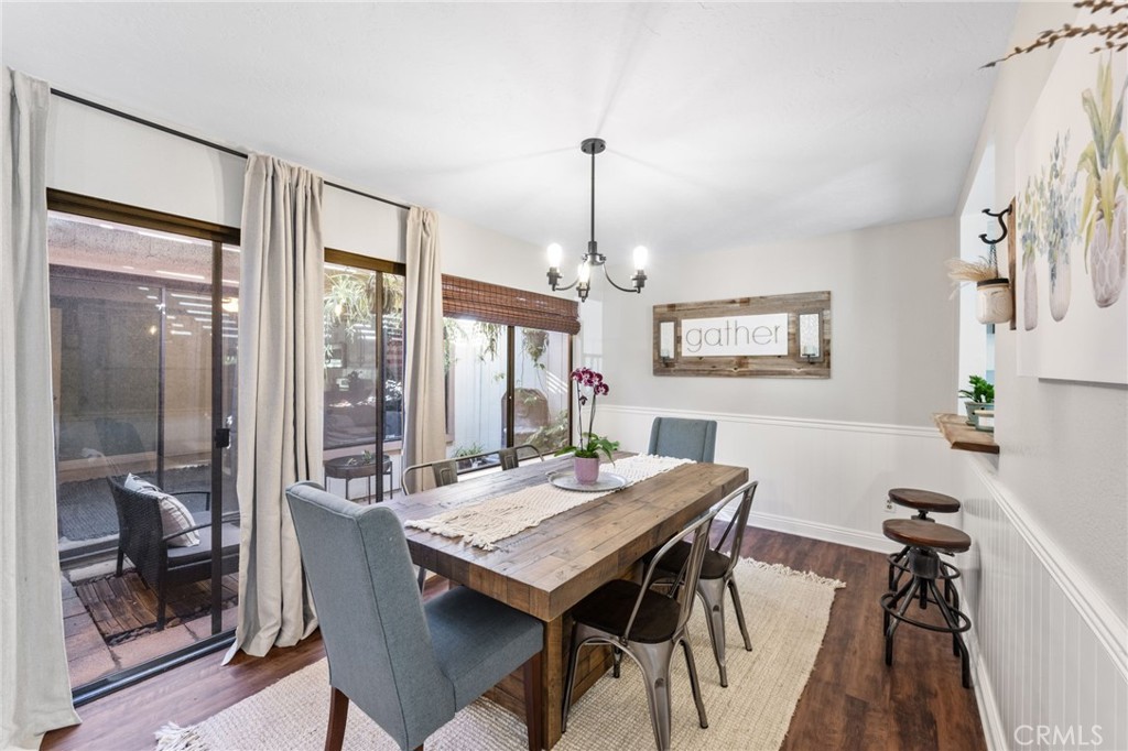 2565 Laramie Road Riverside, CA 92506 - Photo 8 of 46 a view of a dining room with furniture window and wooden floor