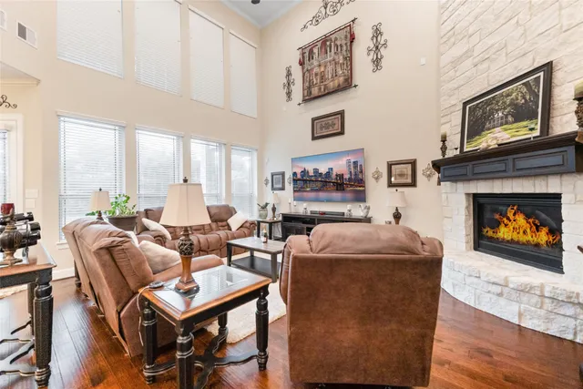 a living room with fireplace furniture and a fireplace