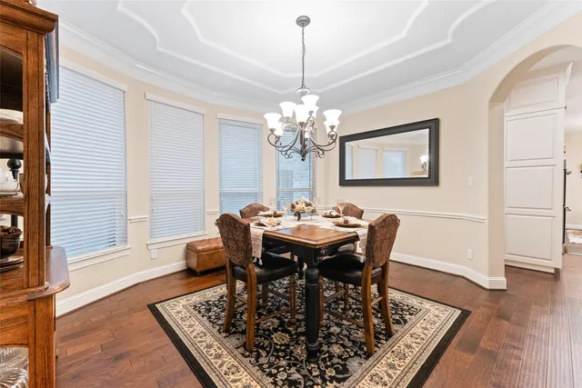 a kitchen with stainless steel appliances kitchen island granite countertop a stove and a refrigerator