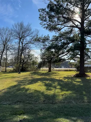 a swimming pool with an outdoor space and seating area