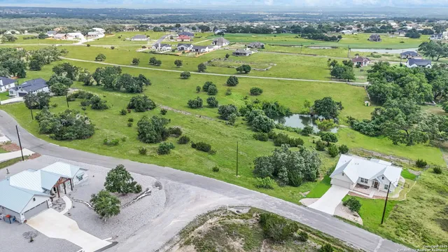an aerial view of a golf course with a garden