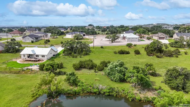 a view of a lake with a yard