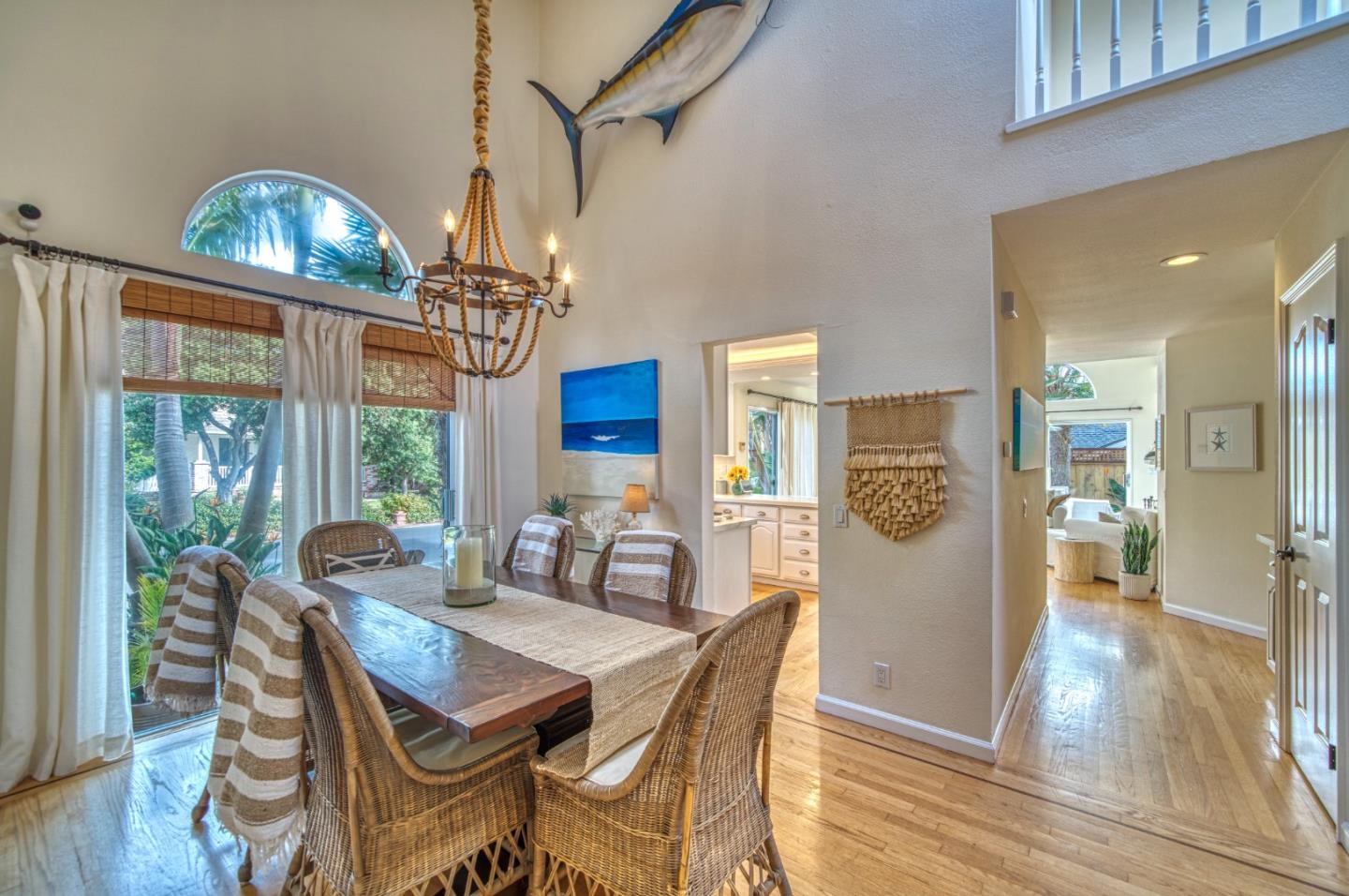 388 Greenbrier Road Half Moon Bay, CA 94019 - Photo 11 of 46 a view of a dining room with furniture a chandelier and wooden floor