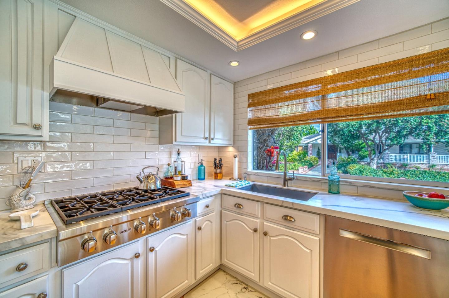 388 Greenbrier Road Half Moon Bay, CA 94019 - Photo 14 of 46 a kitchen with stainless steel appliances a stove sink and cabinets