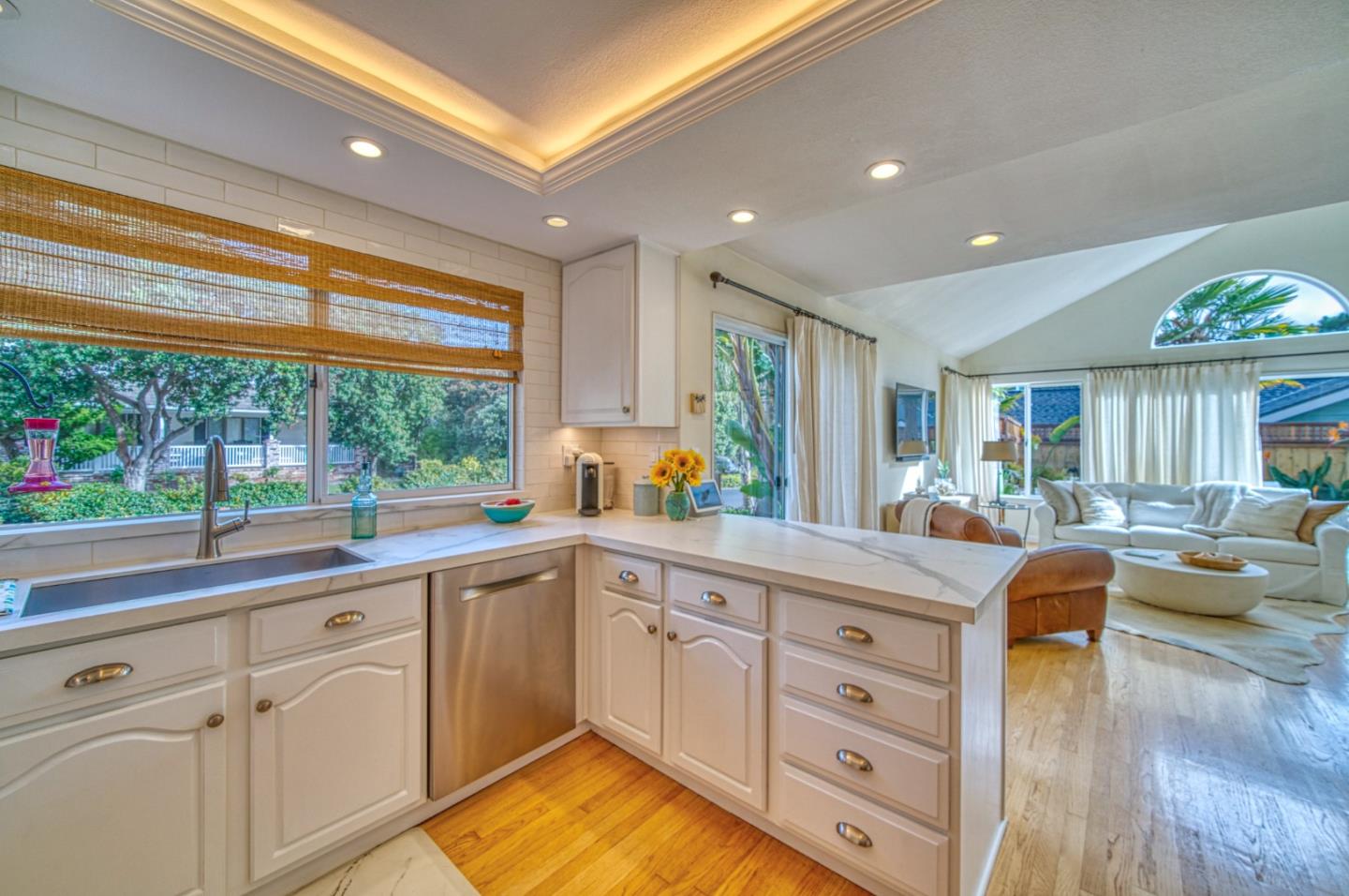388 Greenbrier Road Half Moon Bay, CA 94019 - Photo 16 of 46 a open kitchen with white cabinets and wooden floor