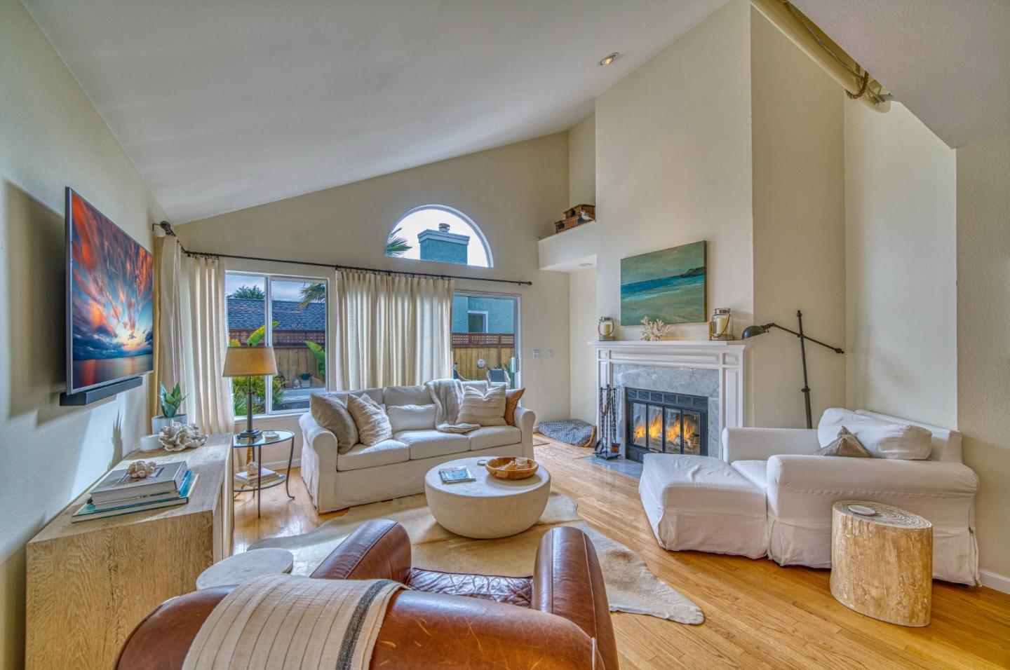 388 Greenbrier Road Half Moon Bay, CA 94019 - Photo 17 of 46 a living room with furniture fireplace and a flat screen tv