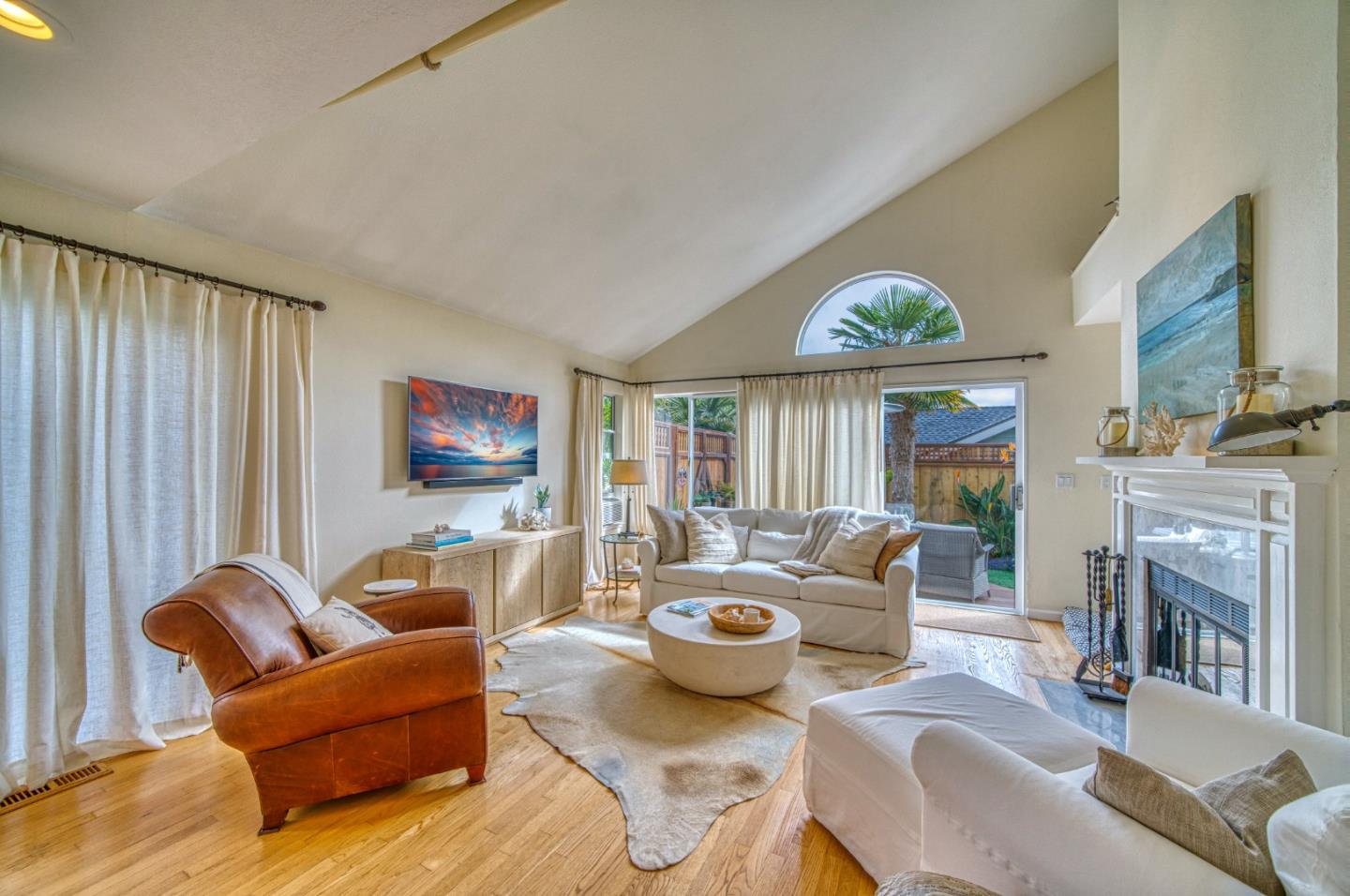 388 Greenbrier Road Half Moon Bay, CA 94019 - Photo 19 of 46 a living room with furniture a fireplace and a flat screen tv