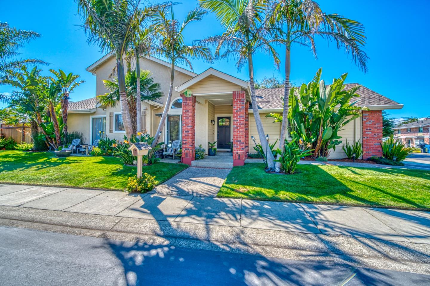 388 Greenbrier Road Half Moon Bay, CA 94019 - Photo 2 of 46 a front view of a house with a yard and potted plants