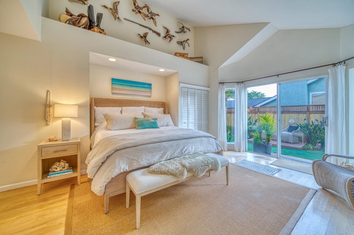 388 Greenbrier Road Half Moon Bay, CA 94019 - Photo 21 of 46 a bedroom with a bed and wooden floor