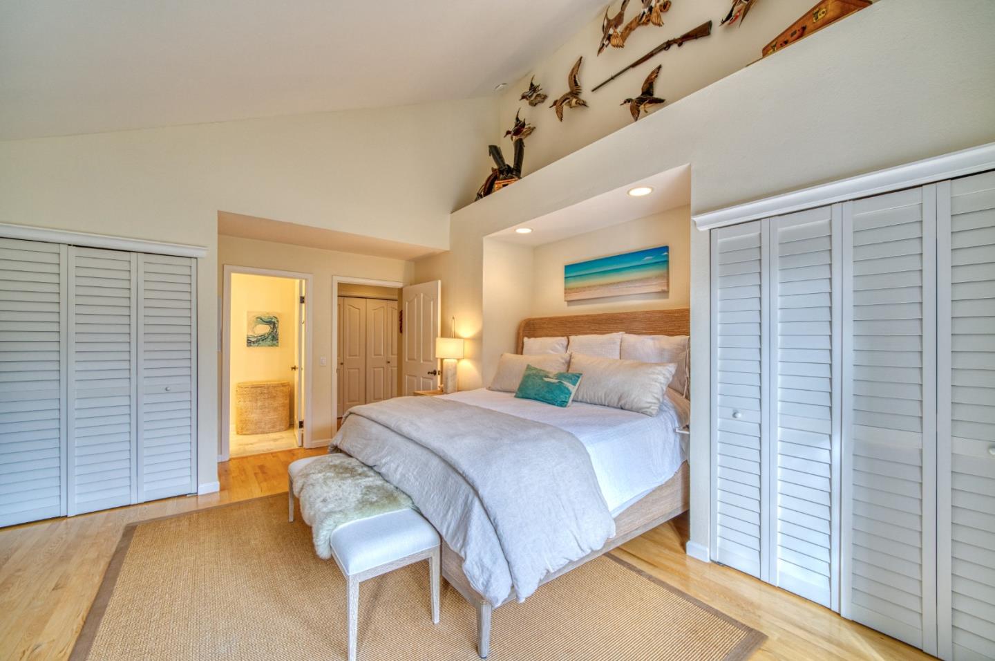 388 Greenbrier Road Half Moon Bay, CA 94019 - Photo 22 of 46 a bedroom with a bed and wooden floor