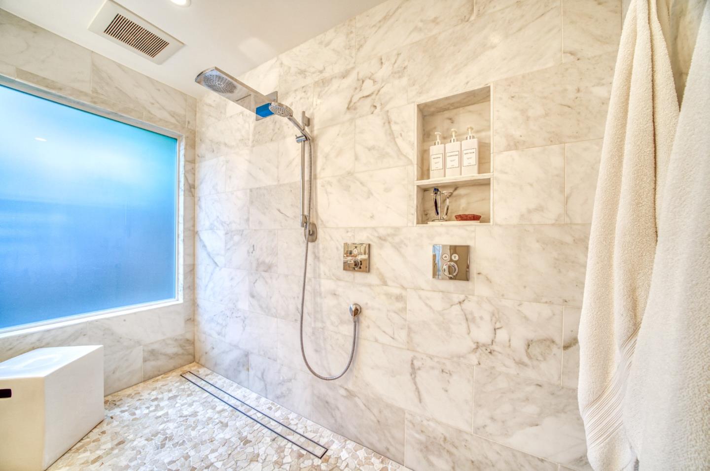 388 Greenbrier Road Half Moon Bay, CA 94019 - Photo 26 of 46 a bathroom with a glass shower door