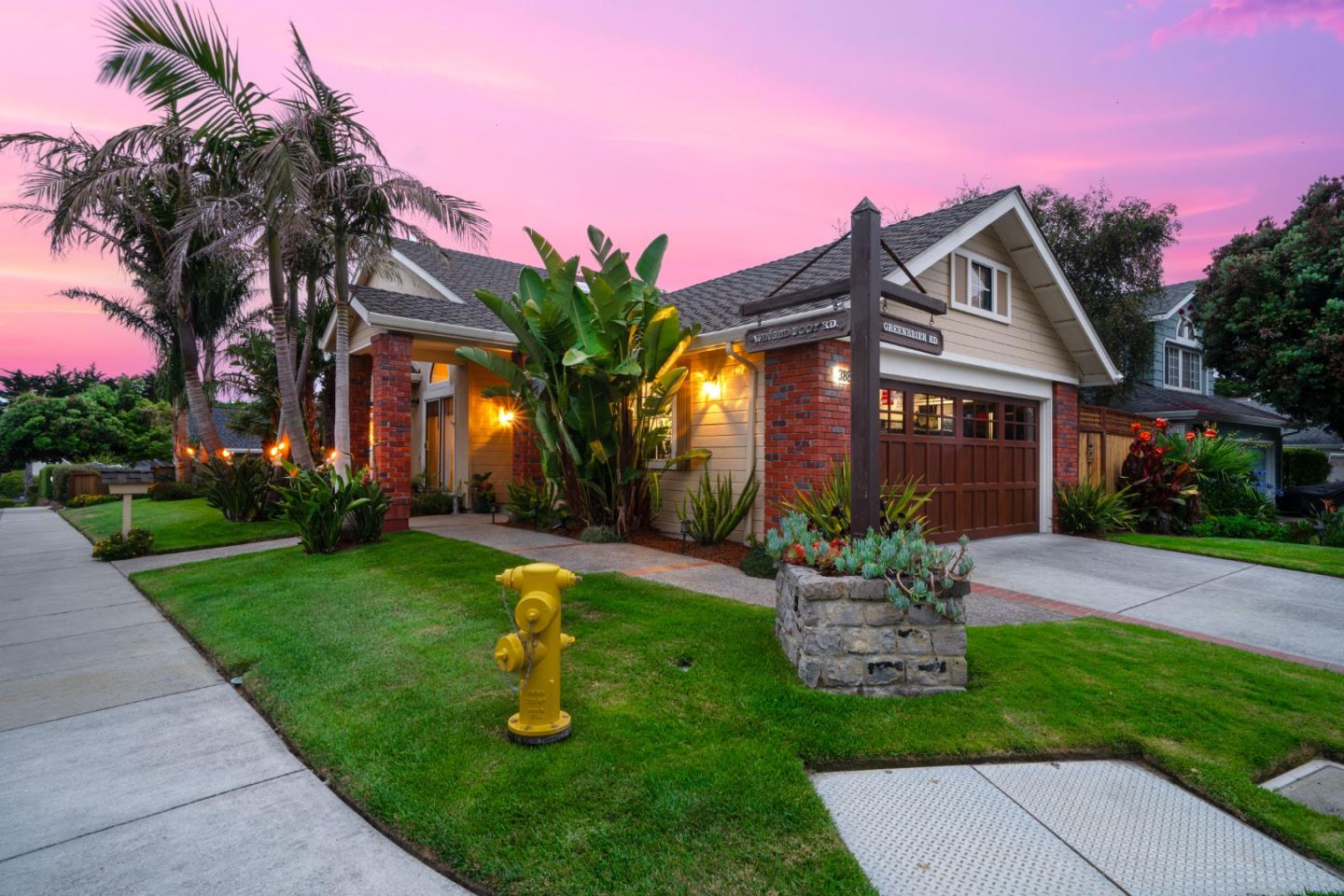 388 Greenbrier Road Half Moon Bay, CA 94019 - Photo 45 of 46 a front view of a house with garden and a yard