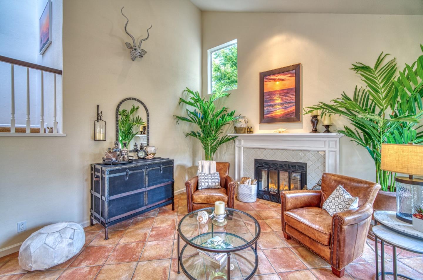 388 Greenbrier Road Half Moon Bay, CA 94019 - Photo 8 of 46 a living room with furniture a fireplace and potted plants