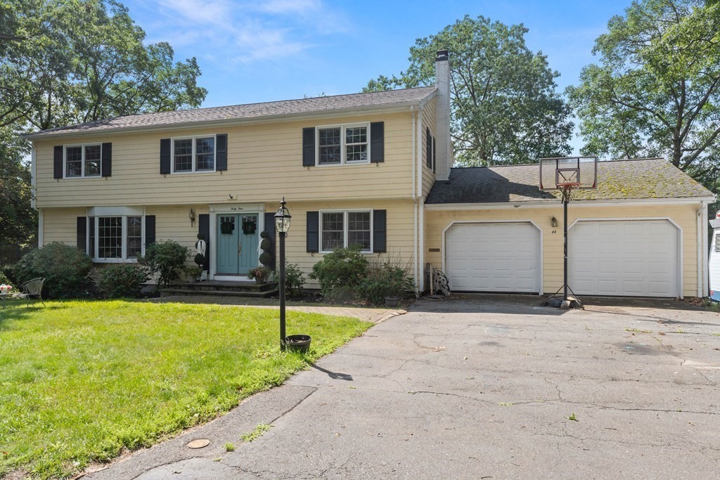 44 Crestwood Road Marblehead, MA 01945 - Photo 1 of 42 a front view of a house with a yard and garage