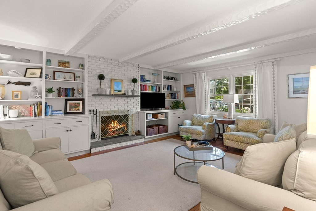 44 Crestwood Road Marblehead, MA 01945 - Photo 13 of 42 a living room with furniture large window and a fireplace
