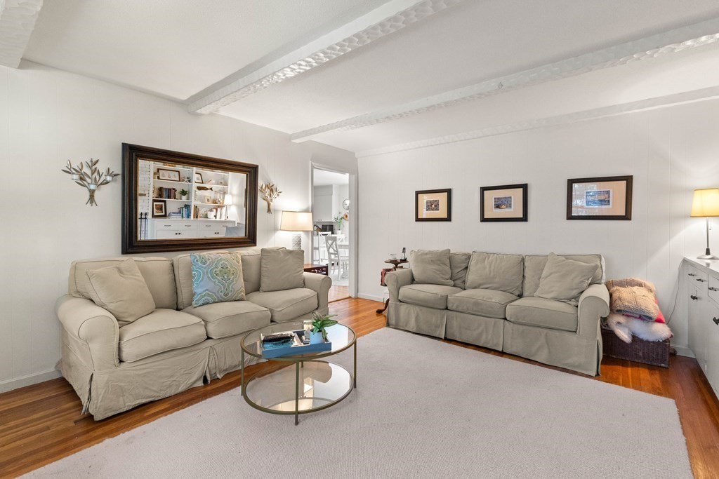 44 Crestwood Road Marblehead, MA 01945 - Photo 14 of 42 a living room with furniture a couch and painting on the wall
