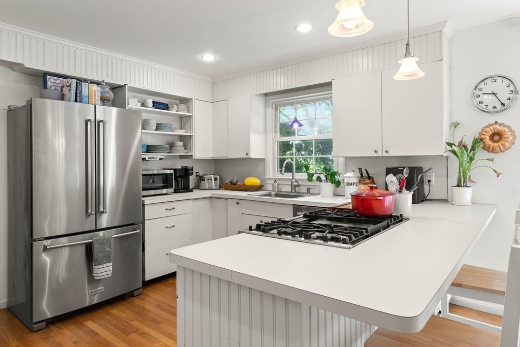 44 Crestwood Road Marblehead, MA 01945 - Photo 16 of 42 a kitchen with a refrigerator and a stove top oven