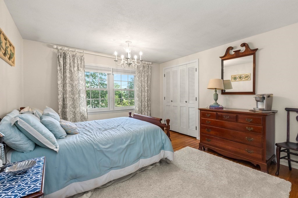 44 Crestwood Road Marblehead, MA 01945 - Photo 24 of 42 a bedroom with a bed and a mirror on the dresser