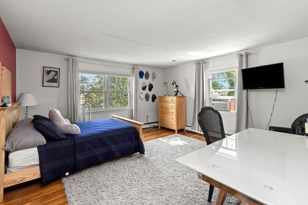 44 Crestwood Road Marblehead, MA 01945 - Photo 25 of 42 a bedroom with a bed and a flat screen tv