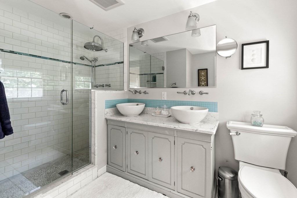44 Crestwood Road Marblehead, MA 01945 - Photo 32 of 42 a bathroom with a granite countertop sink mirror and toilet