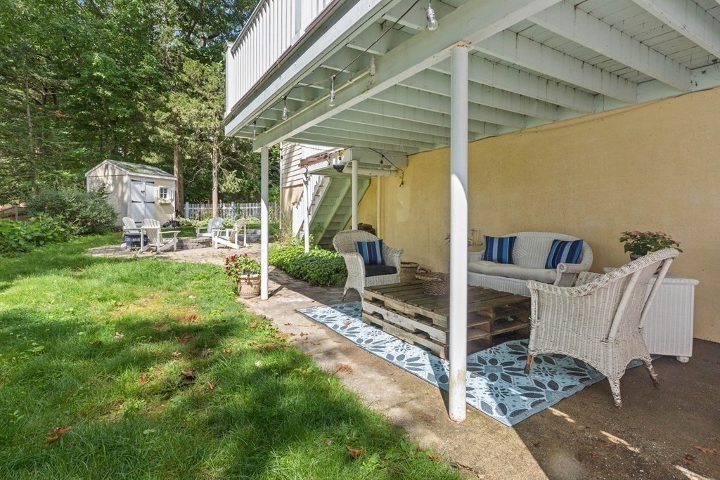 44 Crestwood Road Marblehead, MA 01945 - Photo 40 of 42 a view of a patio with table and chairs and potted plants