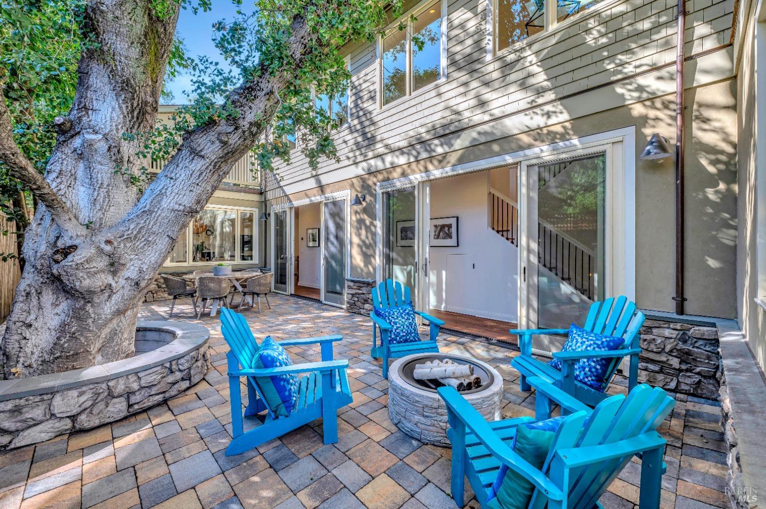a view of outdoor sitting area with furniture and wooden floor