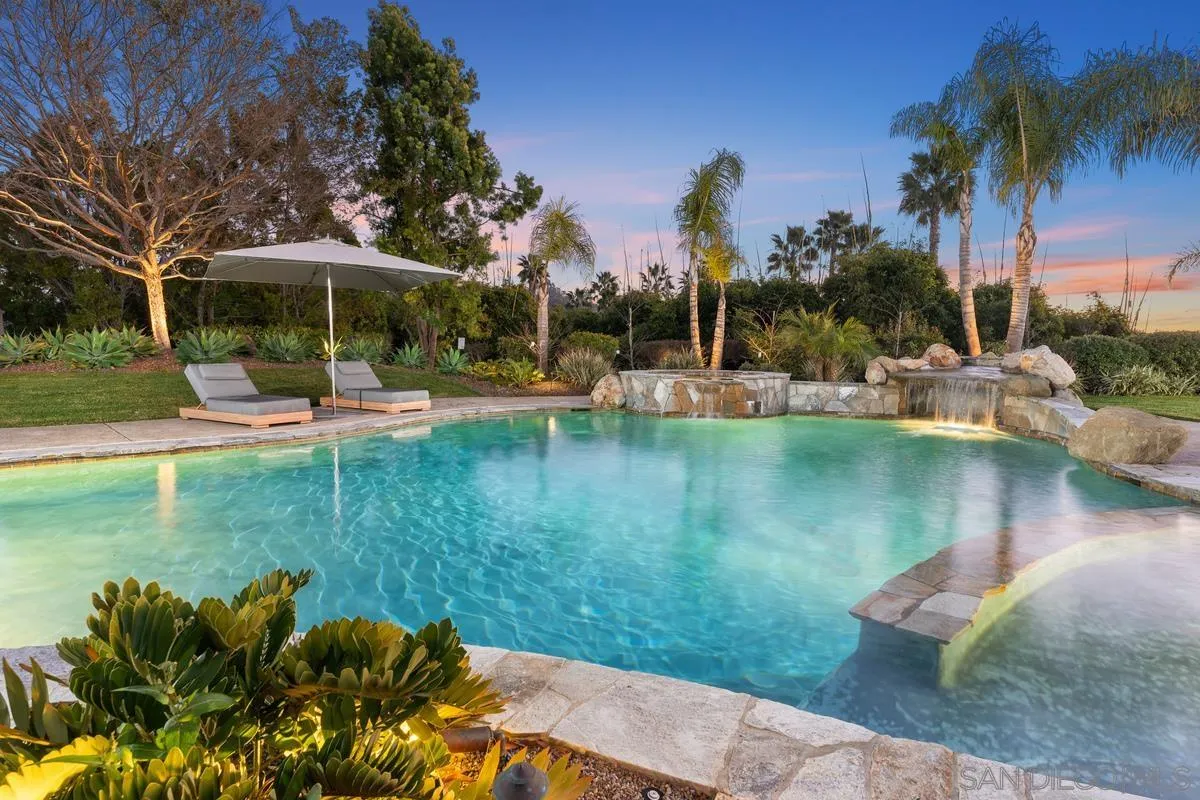 14778 El Rodeo Court Rancho Santa Fe, CA 92067 - Photo 26 of 29 a view of a lake with a garden