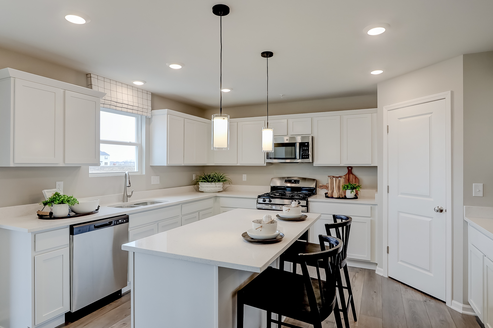 612 Endicott Road South Elgin, IL 60177 - Photo 12 of 30 a kitchen with kitchen island granite countertop a sink a counter space appliances and cabinets