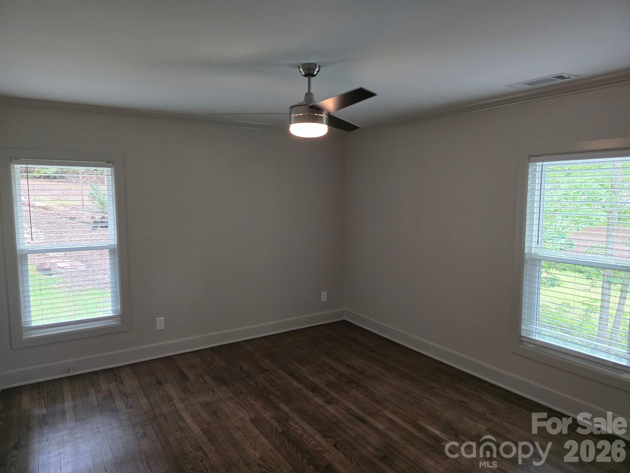 126 Sunset Drive Chester, SC 29706 - Photo 19 of 31 an empty room with wooden floor fan and window
