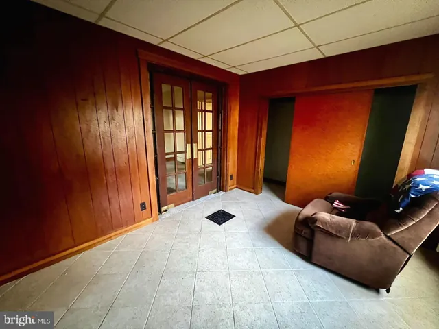 a view of a room that has a bed